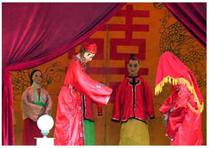 	A puppet show: a
								wedding
								